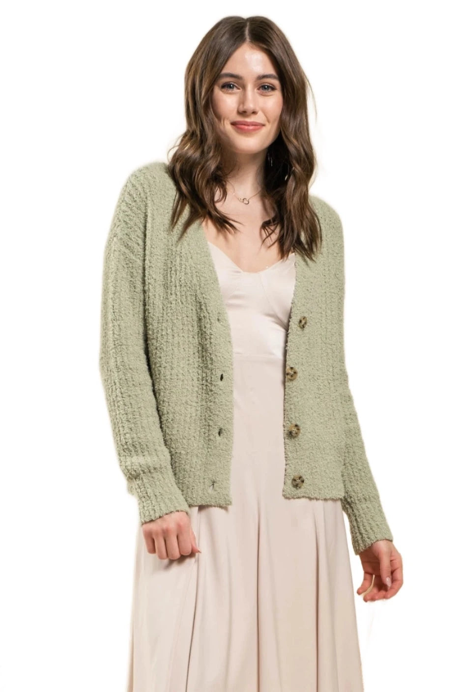 woman wearing soft fuzzy sage green pastel cardigan. button down cardigan with long sleeves chic casual everyday sweater