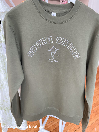 Olive green crew neck sweatshirt that says South Shore embroidered on it in white with a light house. New England pride Boston preppy style casual