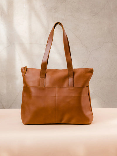 carry-on tote commuter bag leather ethical sustainable women purse tote shoulder pockets storage gift for her ideas holidays christmas birthday chic classic timeless style lux neutral brown sustainable modern