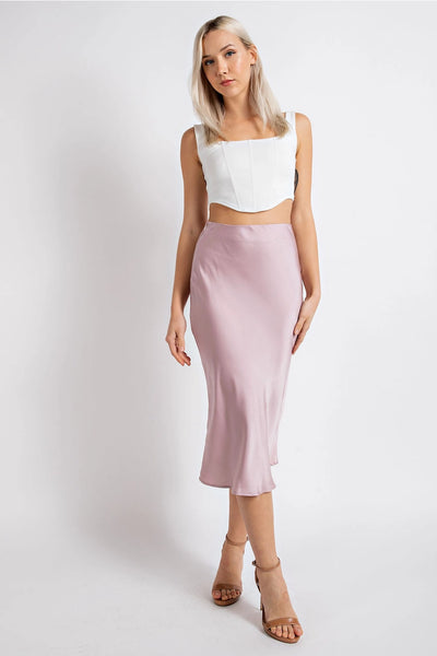 Women's midi skirt satin dusty pink color lightweight chic. Elastic waistband comfortable and easy to dress up or down.