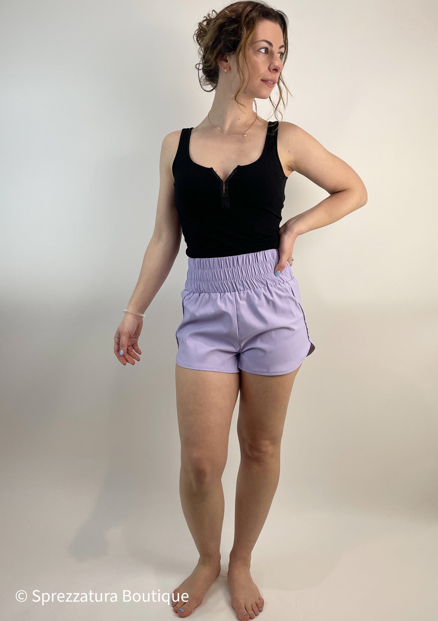 Lilac track shorts. Lightweight super high rise women's shorts for exercise or athleisure casual shorts. Elastic waistband comfortable shorts in lavender. Pastel purple shorts Casual women's clothing outfit summer style feminine