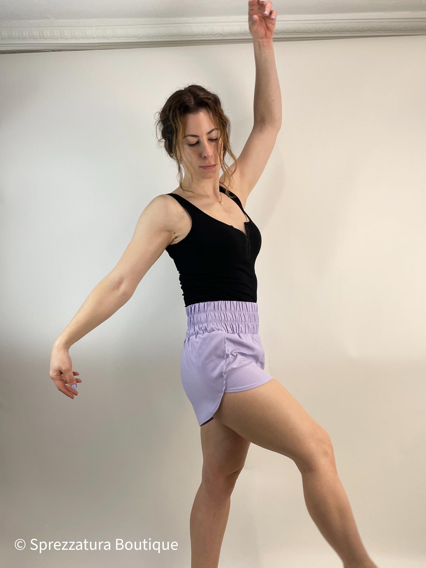 Lilac track shorts. Lightweight super high rise women's shorts for exercise or athleisure casual shorts. Elastic waistband comfortable shorts in lavender. Pastel purple shorts