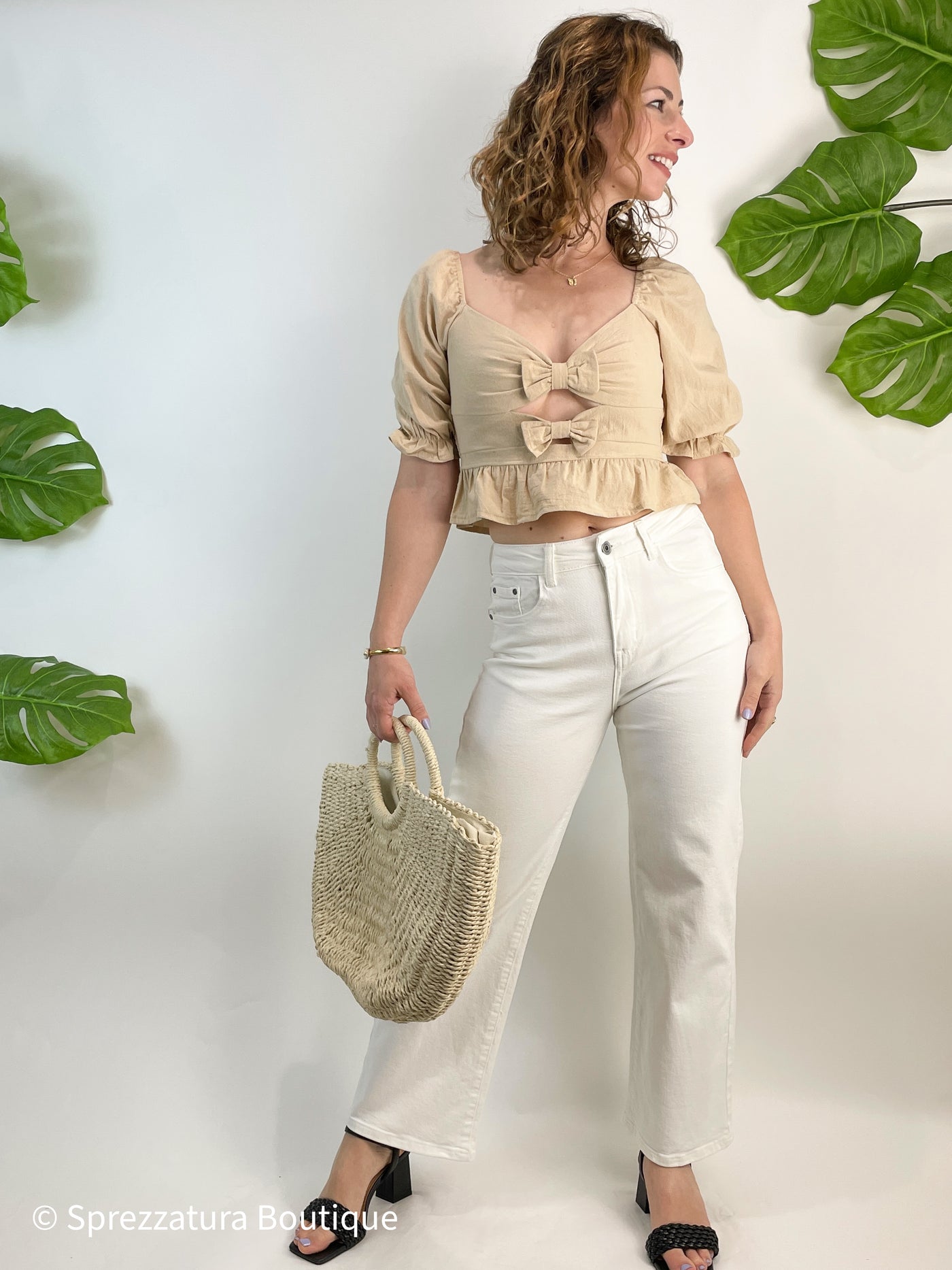 Neutral taupe color bow tie cut out detail blouse. Cropped top with ruffle adorable causal top with jeans or shorts. Natural color women's blouse for summer or fall with bows and ruffles. Cutout detail
