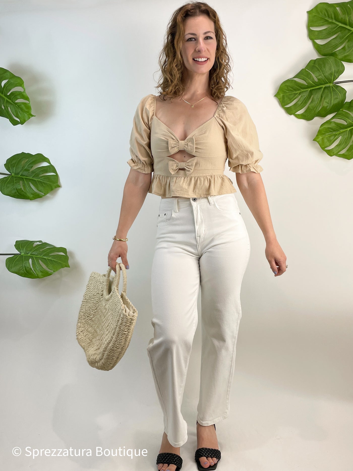 Neutral taupe color bow tie cut out detail blouse. Cropped top with ruffle adorable causal top with jeans or shorts. Natural color women's blouse for summer or fall with bows and ruffles. Cutout detail Zip up back detail and tie
