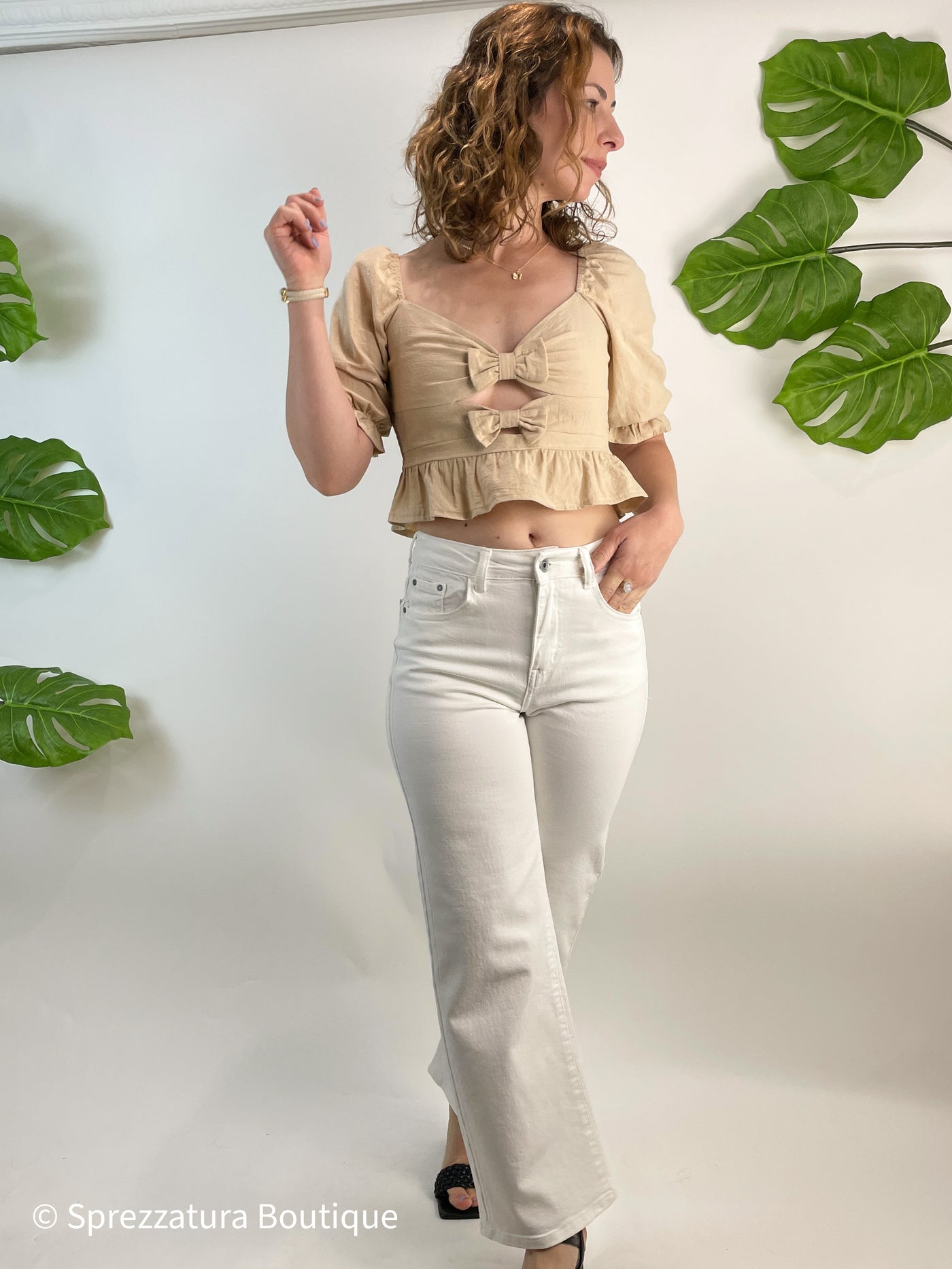 Neutral taupe color bow tie cut out detail blouse. Cropped top with ruffle adorable causal top with jeans or shorts. Natural color women's blouse for summer or fall with bows and ruffles. Cutout detail