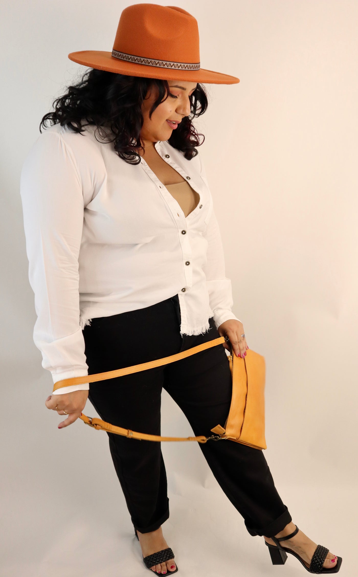 High quality leather crossbody purse made by hand by women that are paid a living wage. Cognac colored purse in buttery leather. Lots of pockets and detachable shoulder strap makes it great for traveling.