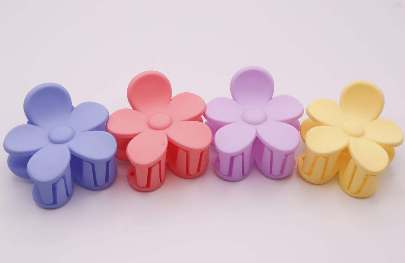 White, pink, and periwinkle, lavender, yellow colored flower small hair clips. Daisy hair clips
