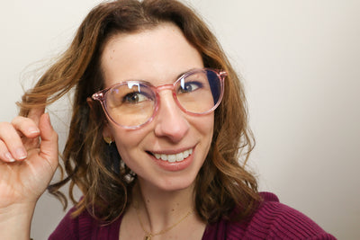 Pink translucent framed blue light blocking glasses. Round frame women's glasses
