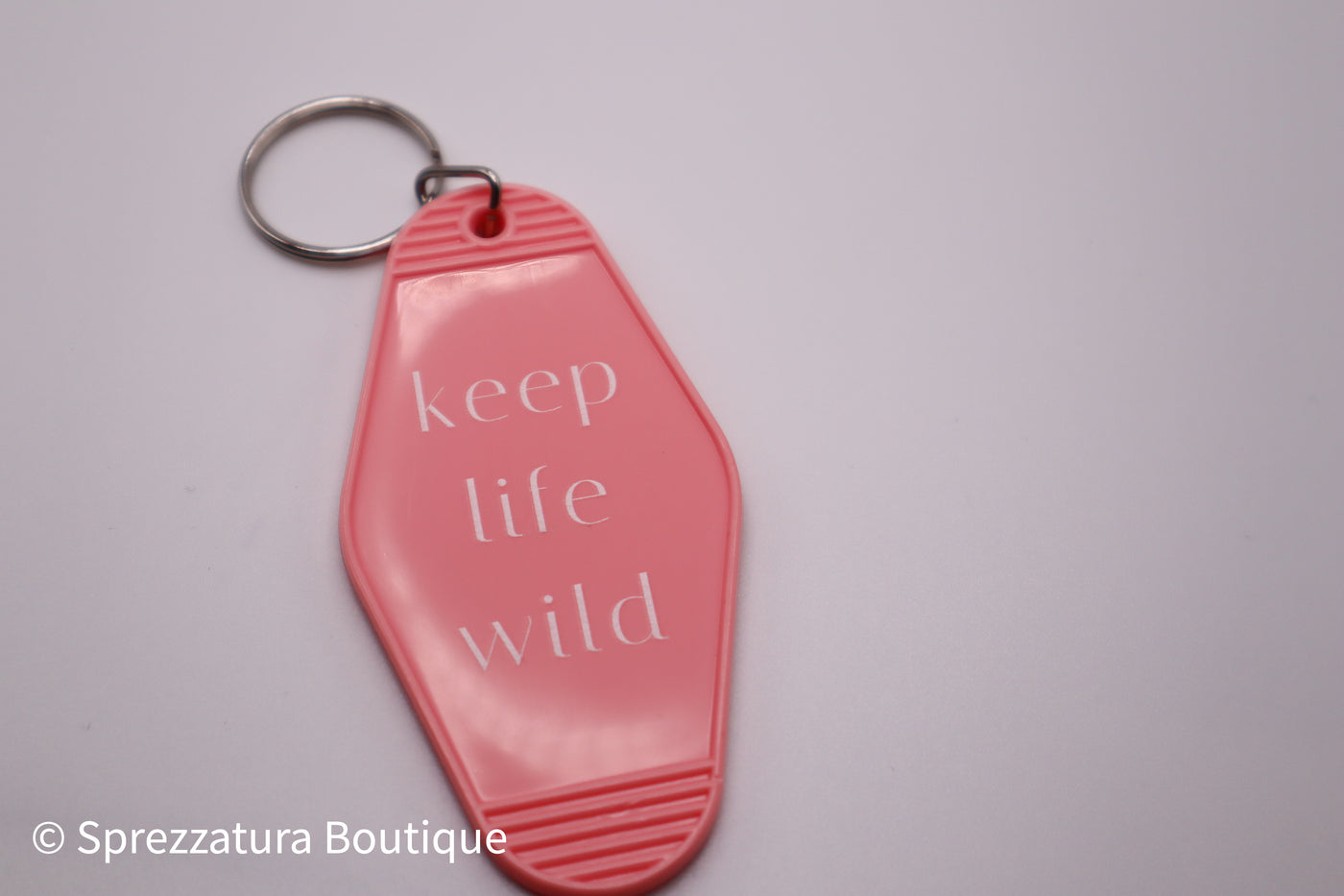 Pink keep life wild keychain. Retro vintage motel style keychain makes a great gift.